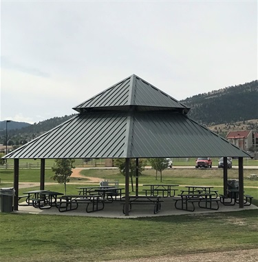 Picnic tables under a shelter.