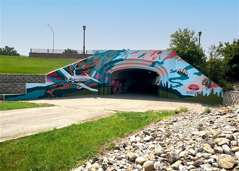 Mural painted on the entrance to a tunnel.